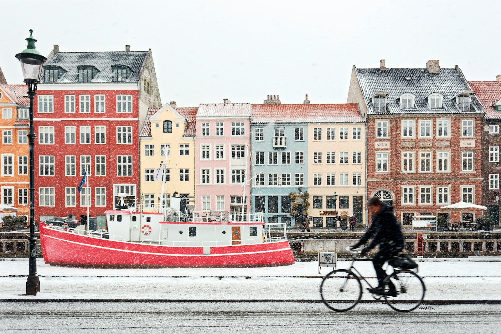 man riding on black bicycle