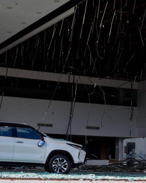 a white truck parked in front of a building