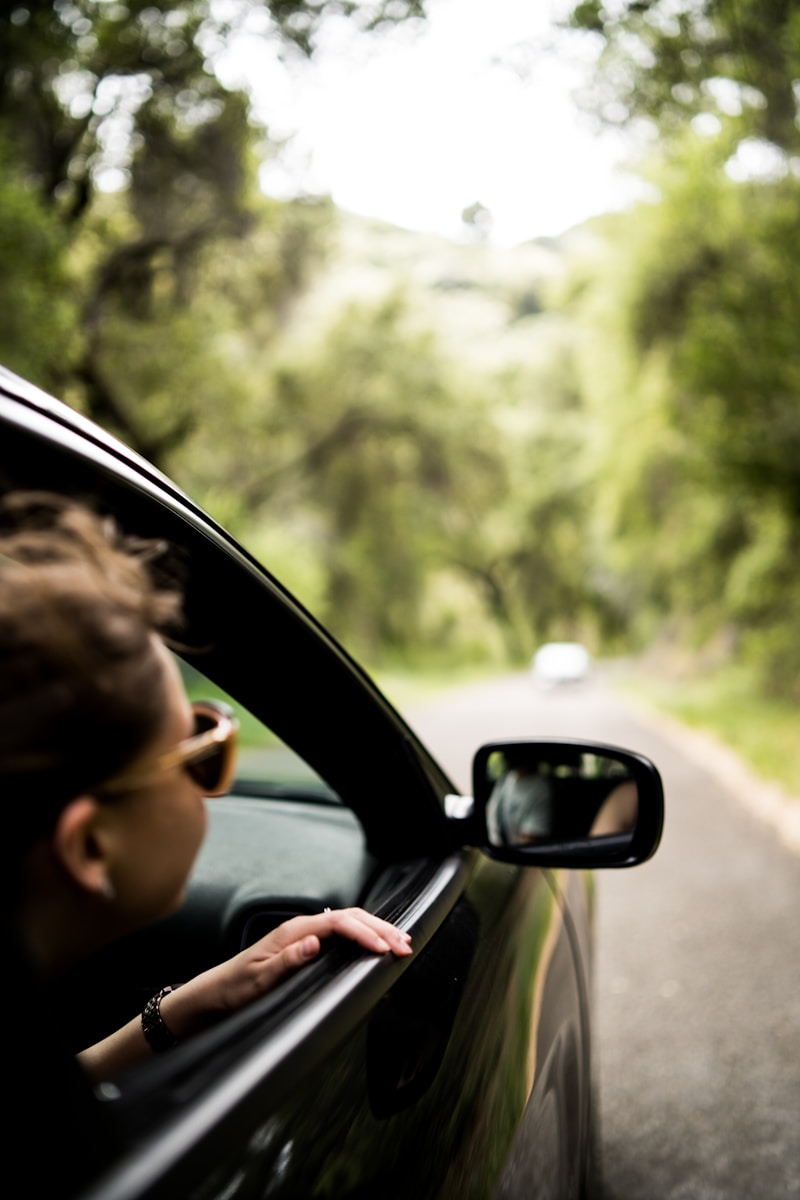 woman sitting inside vehicle