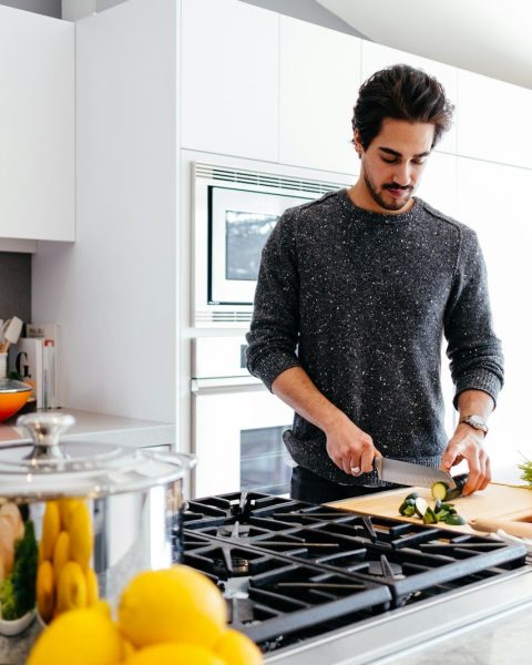 man cutting vegetables