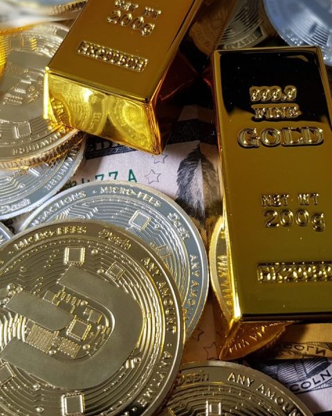a pile of gold and silver coins